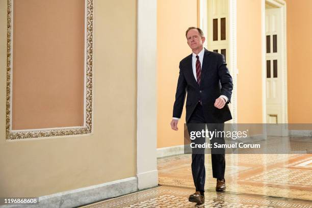 Senator Pat Toomey heads back to the Senate floor from the Republican dinner during a recess in the Senate impeachment trial of President Donald...