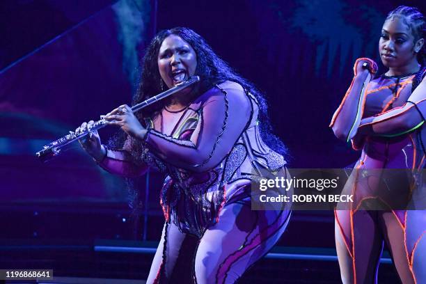 Singer-songwriter Lizzo performs onstage during the 62nd Annual Grammy Awards on January 26 in Los Angeles.