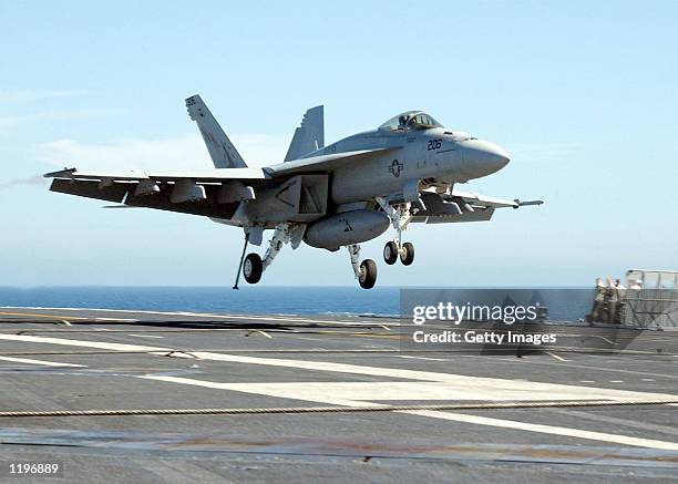 An F/A18 "Super Hornet" piloted by Lt. Corey L. Pritchard makes the first carrier landing of the new plane July 24, 2002 onboard the USS Abraham...
