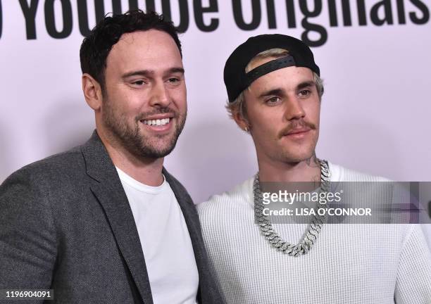 Businessman Scooter Braun and Canadian singer Justin Bieber arrive for YouTube Originals' "Justin Bieber: Seasons" premiere at the Regency Bruin...