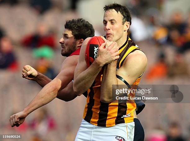 David Hale of the Hawks marks the ball during the round 18 AFL match between the Melbourne Demons and the Hawthorn Hawks at Melbourne Cricket Ground...