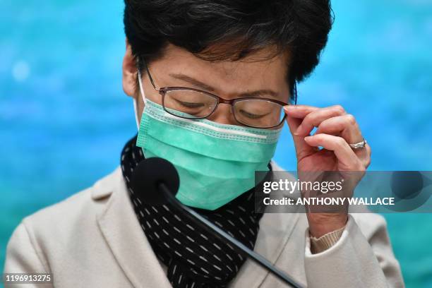 Hong Kong's Chief Executive Carrie Lam takes part in a press conference while wearing a facemask in Hong Kong on January 28 to update the territory...