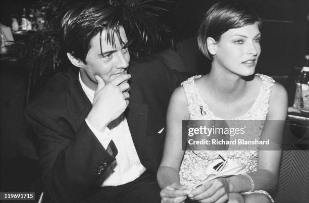 American actor Kyle MacLachlan and his girlfriend, Canadian model Linda Evangelista attend a party for the film 'Ed Wood' at the Cannes Film...