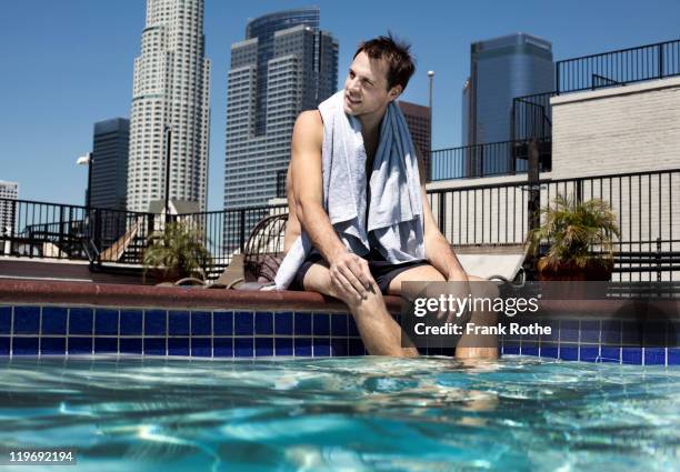 Sitting By Pool Rapper Man Sitting By Swimming Pool Photos and Premium High Res Pictures ...