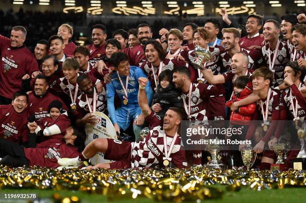 Lukas Podolski celebrates with team mates after the trophy presentation of the 99th Emperor's Cup final between Vissel Kobe and Kashima Antlers at...