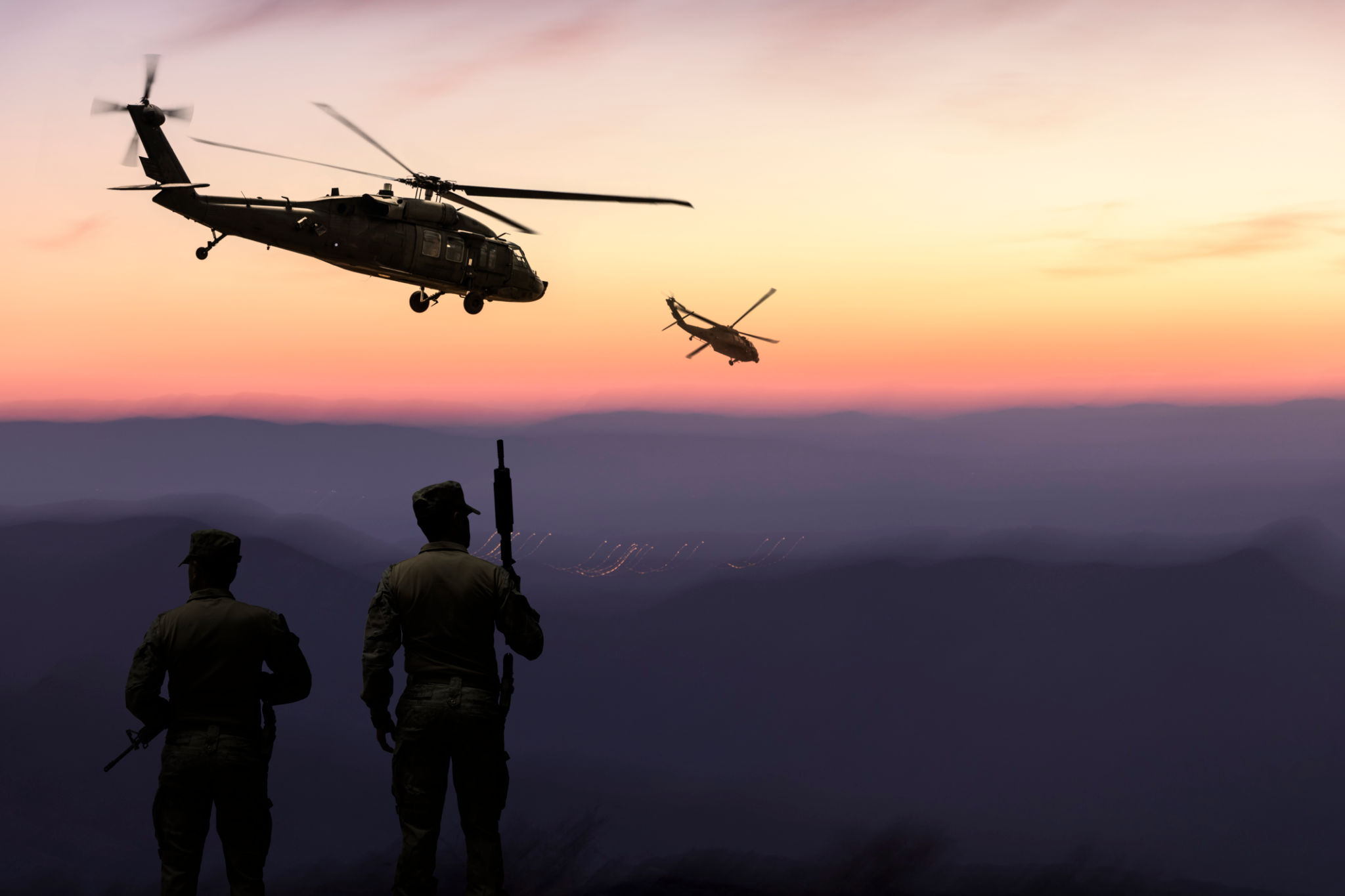 Military Helicopter and Army Soldiers Overlook the Setting Sun Military Helicopter and Army Soldiers Overlook the Setting Sun