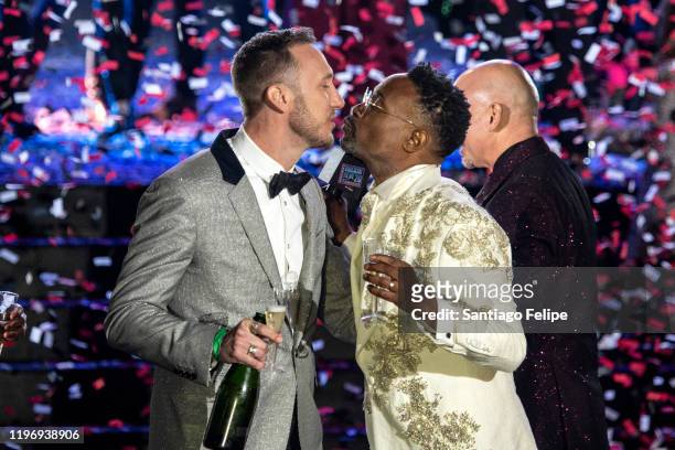 Billy Porter and Adam Porter-Smith celebrate onstage during Dick Clark's New Year's Rockin' Eve Celebration on December 31, 2019 in New Orleans City.