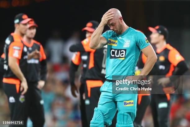 Chris Lynn of the Heat looka on during the Big Bash League match between the Brisbane Heat and the Perth Scorchers at Metricon Stadium on January 01,...