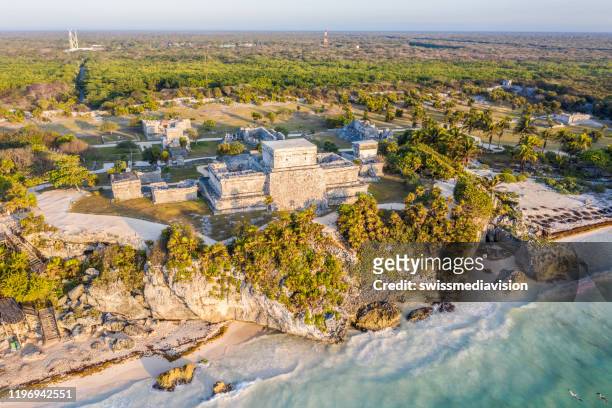 drone view of el castillo, tulum ruins archeological zone, mexico - tulum stock pictures, royalty-free photos & images