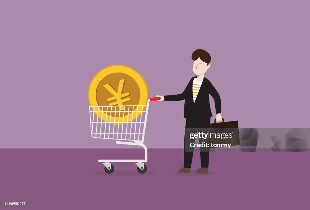 Yen coin in a shopping cart with businessman