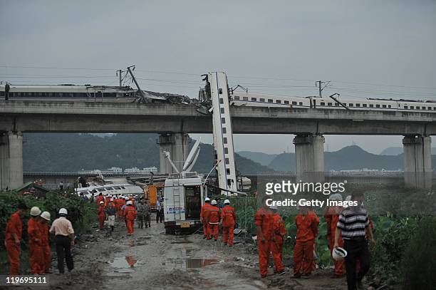 Rescuers work at the accident scene on a bridge on July 24, 2011 in Wenzhou, Zhejiang Province of China. The train from Hangzhou to the city of...