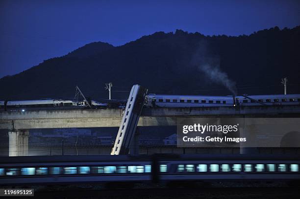 Bullet train numbered D3115 derails on a bridge on July 24, 2011 in Wenzhou, Zhejiang Province of China. The train from Hangzhou to the city of...