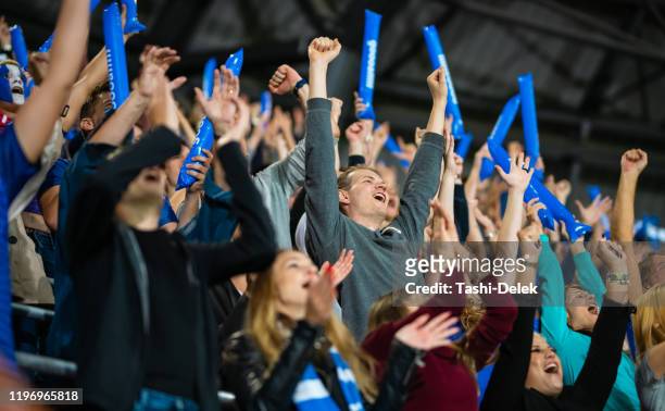 stadium crowd cheering and clapping - crowd cheering stock pictures, royalty-free photos & images