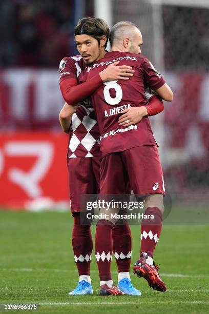 Andres Iniesta and Hotaru Yamaguchi of Vissel Kobe hug during the 99th Emperor's Cup final between Vissel Kobe and Kashima Antlers at the National...