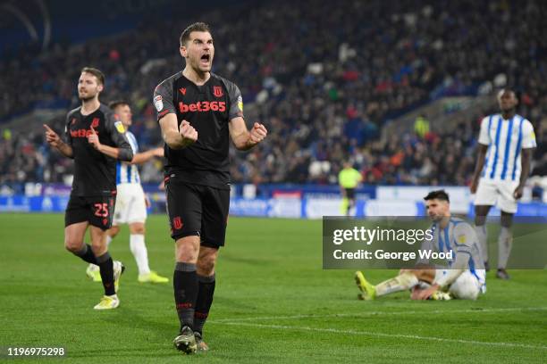 Sam Vokes of Stoke City celebrates after his sides second goal during the Sky Bet Championship match between Huddersfield Town and Stoke City at John...