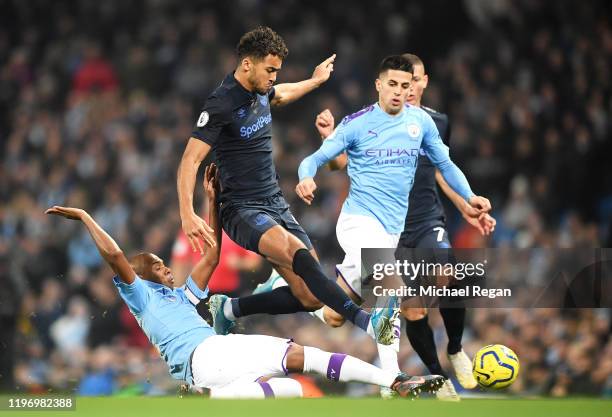 Fernandinho of Manchester City battles for possession with Dominic Calvert-Lewin of Everton of Everton during the Premier League match between...