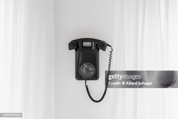 Phone Hangs On A Wall Stock Photo, Picture and Royalty Free Image