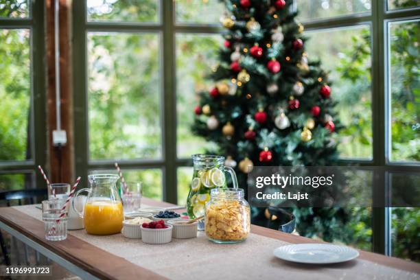 the wonder of christmas morning - breakfast table stock pictures, royalty-free photos & images
