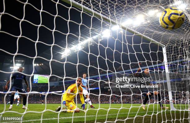 Richarlison of Everton scores his sides first goal past Claudio Bravo of Manchester City during the Premier League match between Manchester City and...