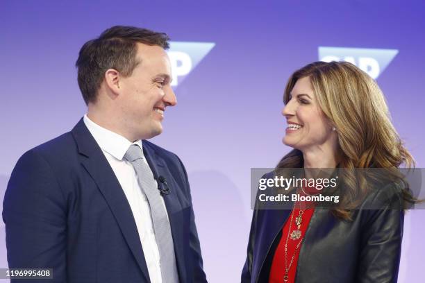 Christian Klein, co-chief executive officer of SAP SE, left, and Jennifer Morgan, co-chief executive officer of SAP SE, react following the company's...