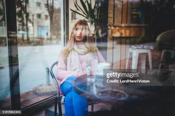 young woman on coffee break - window display stock pictures, royalty-free photos & images