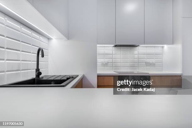 modern kitchen - metal kitchen worktop stock pictures, royalty-free photos & images