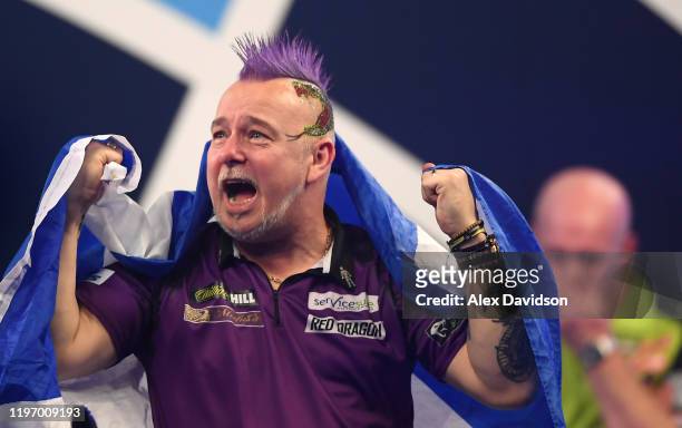 Peter Wright celebrates victory after the Final of the 2020 William Hill World Darts Championship between Peter Wright and Michael van Gerwen at...