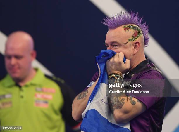 Peter Wright reacts after victory in the Final of the 2020 William Hill World Darts Championship between Peter Wright and Michael van Gerwen at...