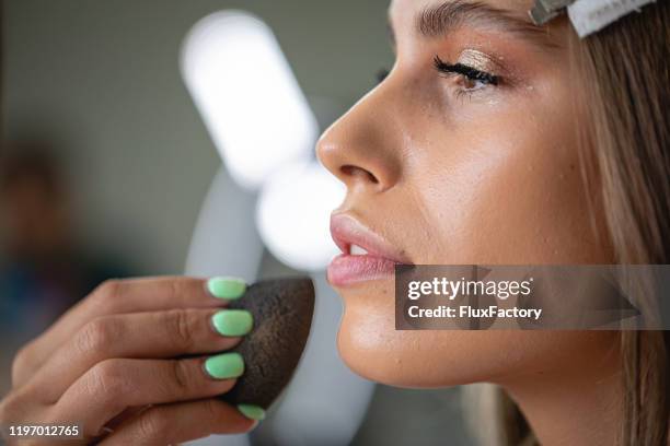 girl enjoying a make-up session - cleaning sponge stock pictures, royalty-free photos & images
