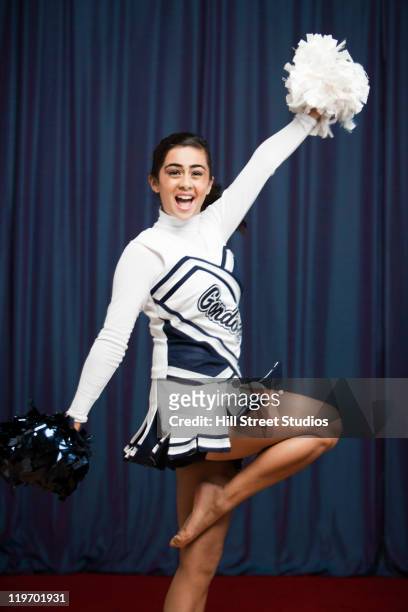 filipino cheerleader with pompoms in uniform - teen cheerleader 個照片及圖片檔