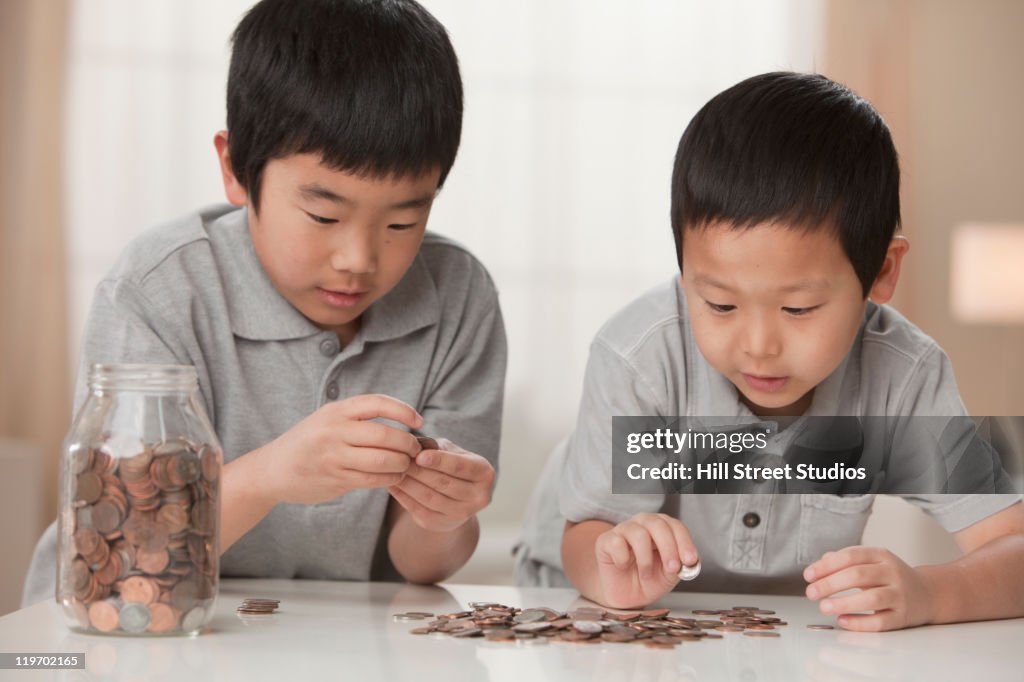 Korean brothers counting coins