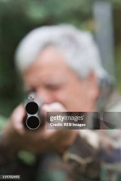 senior chilean man pointing shotgun - hagelgevär bildbanksfoton och bilder