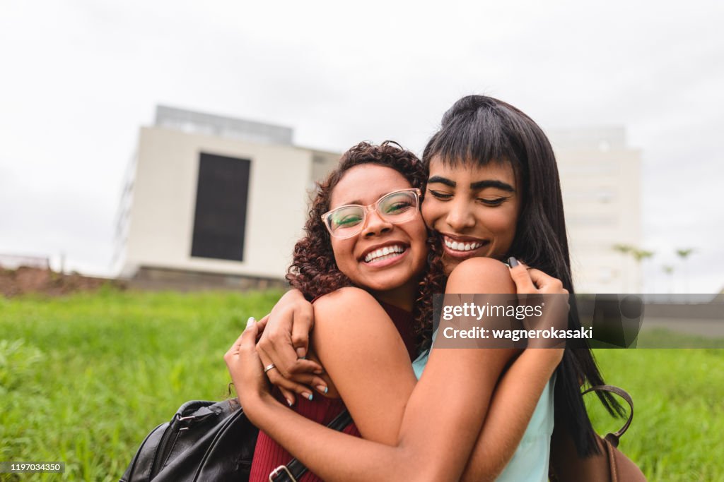 High school students celebrating and hugging each other