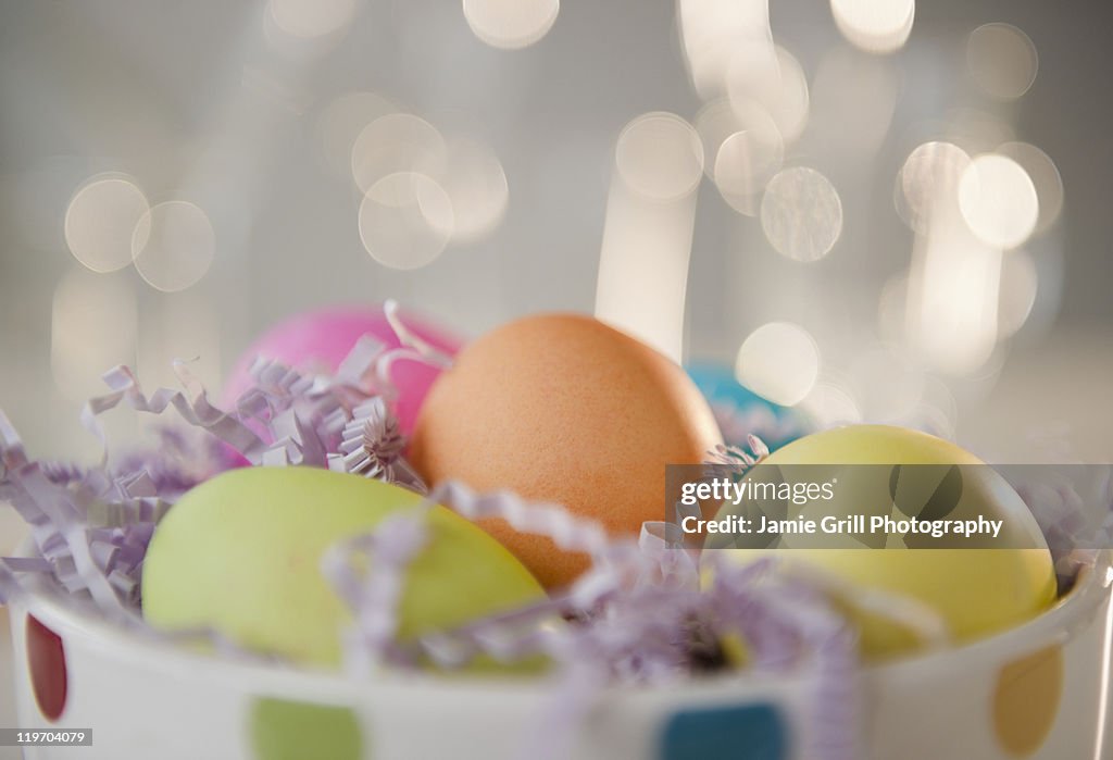 Colored Easter eggs in bowl, studio shot