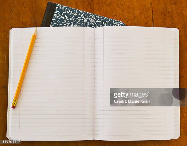 studio shot of open notebook with yellow pencil - 構圖 個照片及圖片檔