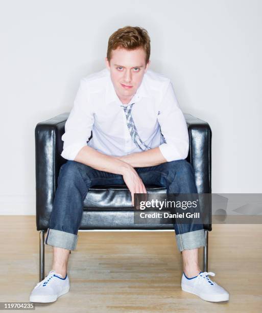 usa, new jersey, jersey city, portrait of man sitting in armchair - arrogance stock pictures, royalty-free photos & images