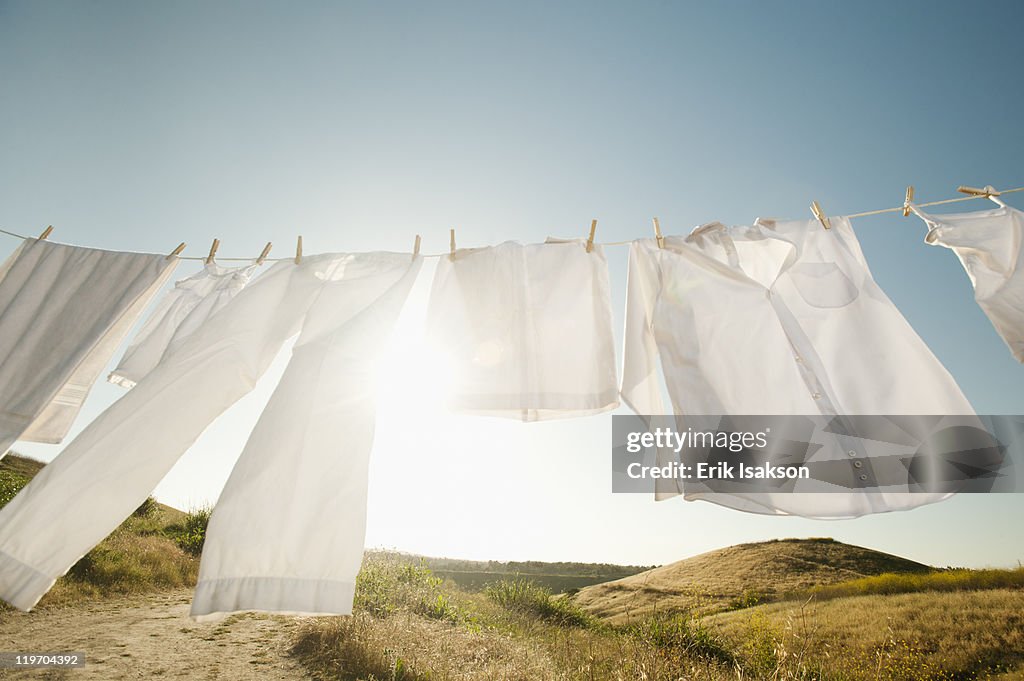 USA, California, Ladera Ranch, Laundry hanging on clothesline against blue sky