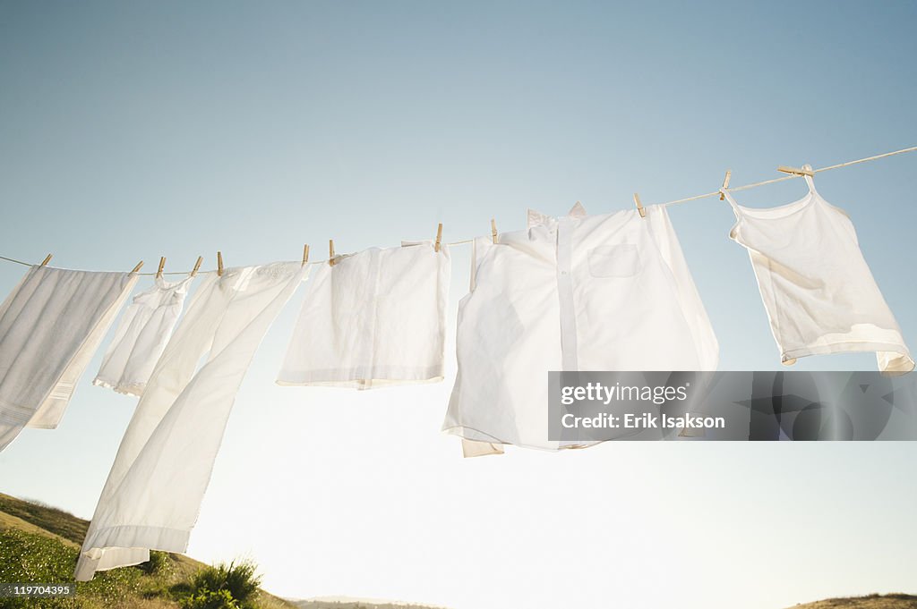 USA, California, Ladera Ranch, Laundry hanging on clothesline against blue sky