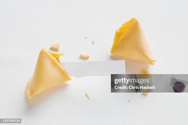 fortune cookie on white background - wish fotografías e imágenes de stock