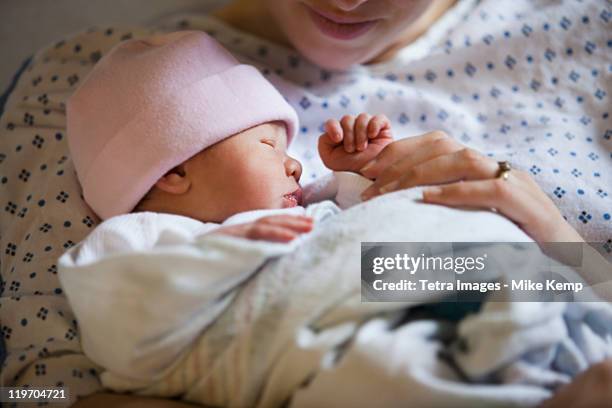 usa, utah, salt lake city, portrait of newborn girl (0-1months) with mother - baby girls fotografías e imágenes de stock