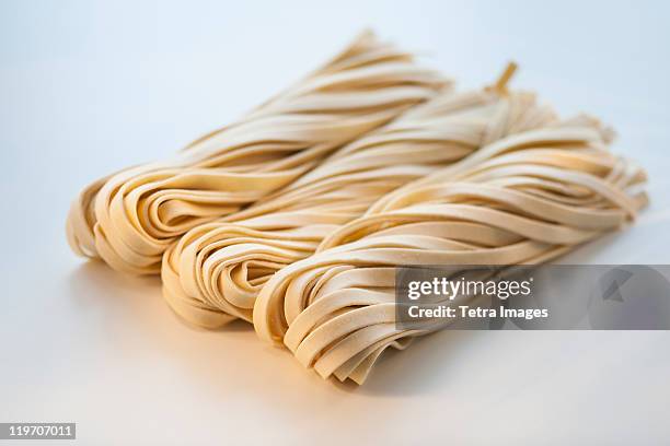 studio shot of fresh linguini pasta - linguine ストックフォトと画像