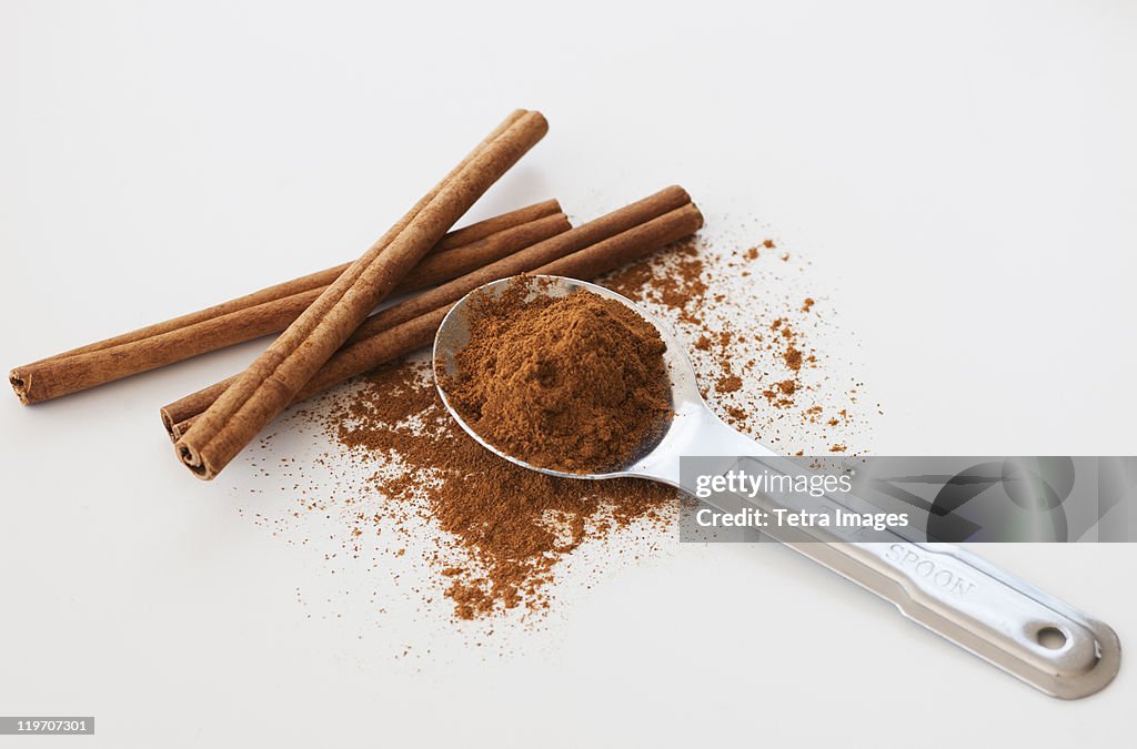 Studio shot of cinnamon stick and cinnamon powder