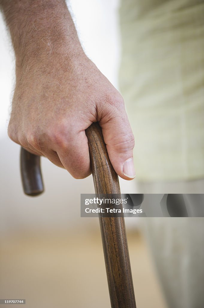 USA, New Jersey, Jersey City, Close-up of senior man's hand on cane