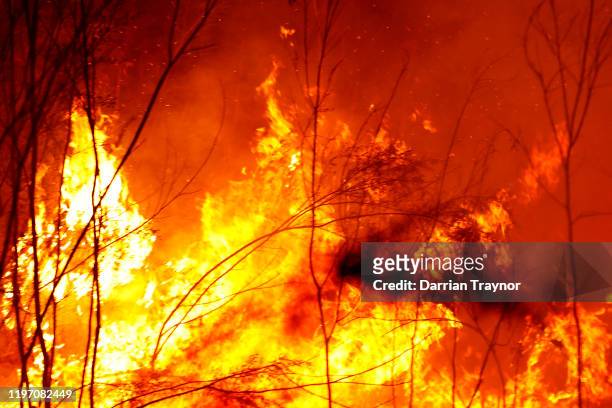 Bushfires burn between the townships of Bemm River and Cann River in eastern Gippsland on January 02 Australia. The HMAS Choules docked outside of...