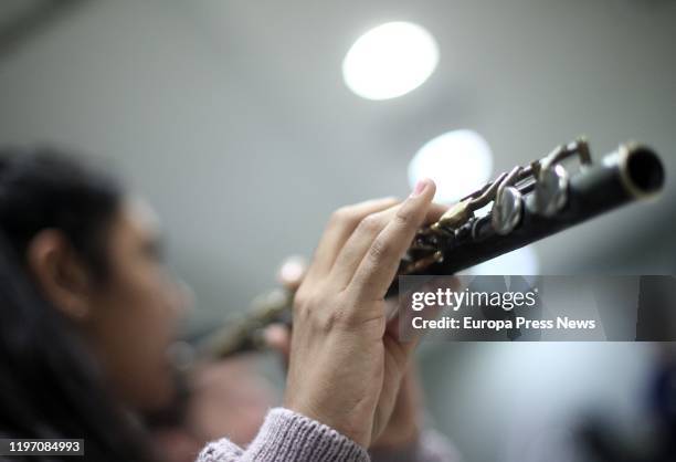 Musician of the ‘Orquesta de Instrumentos Reciclados de Cateura’ , playing her transverse flute during a rehearsal at the Hotel Leonado before the...