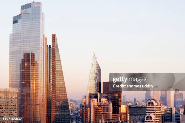 elevated view of london city skyscrapers and the financial district - sunset on canary wharf stock-fotos und bilder