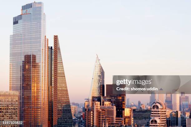 elevated view of london city skyscrapers and the financial district - sunset on canary wharf stock pictures, royalty-free photos & images