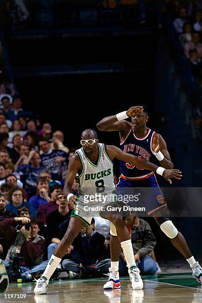 Moses Malone of the Milwaukee Bucks battles for position with Patrick Ewing of the New York Knicks during an NBA game in Milwaukee, Wisconsin. NOTE...