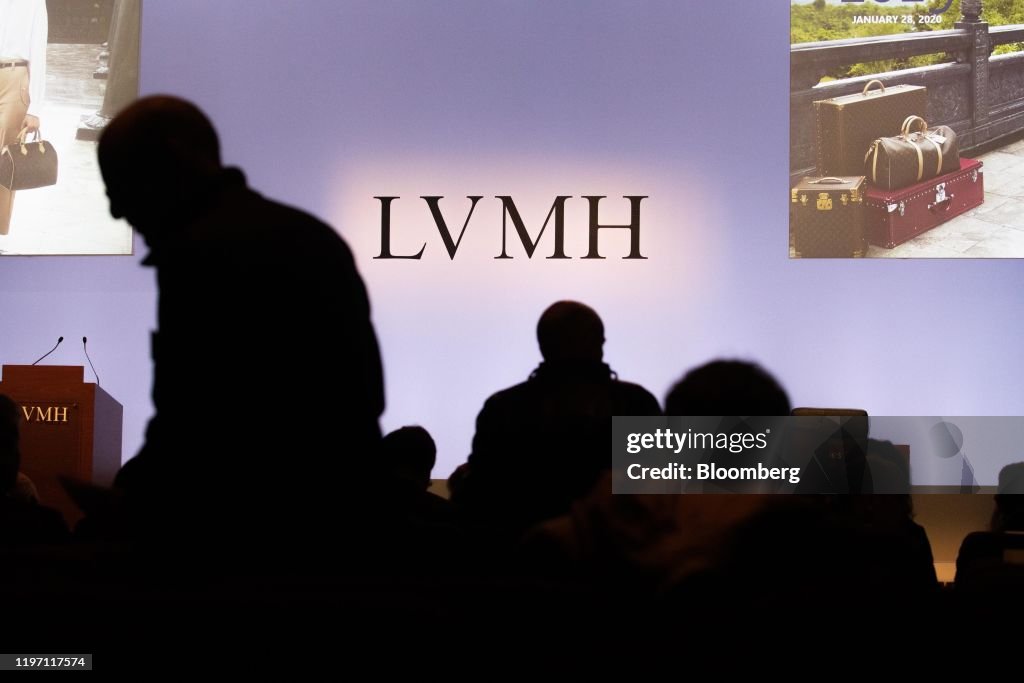 Attendees arrive to an event as LVMH Moet Hennessy Louis Vuitton