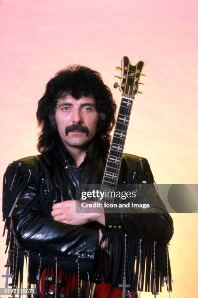 English songwriter, producer, lead guitarist and founding member of the heavy metal band Black Sabbath, Tony Iommi, poses for a portrait backstage at...